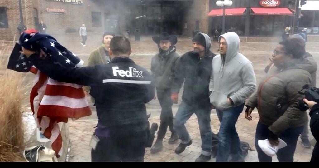 FedEx employee stops flag burning protest | National & World | kxly.com