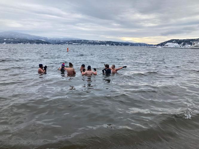 Frigid temperatures don’t stop annual Polar Bear Plunge into Lake Coeur