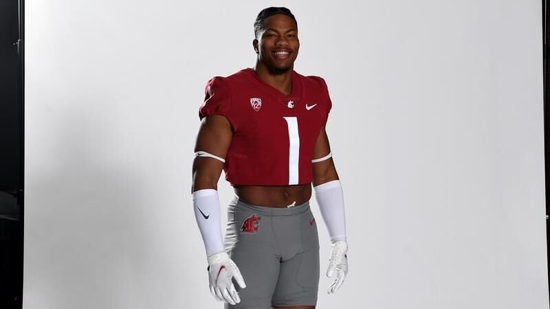 Washington State linebacker Daiyan Henley stands on the field during the  second half of an NCAA college football game against Utah, Thursday, Oct.  27, 2022, in Pullman, Wash. (AP Photo/Young Kwak Stock