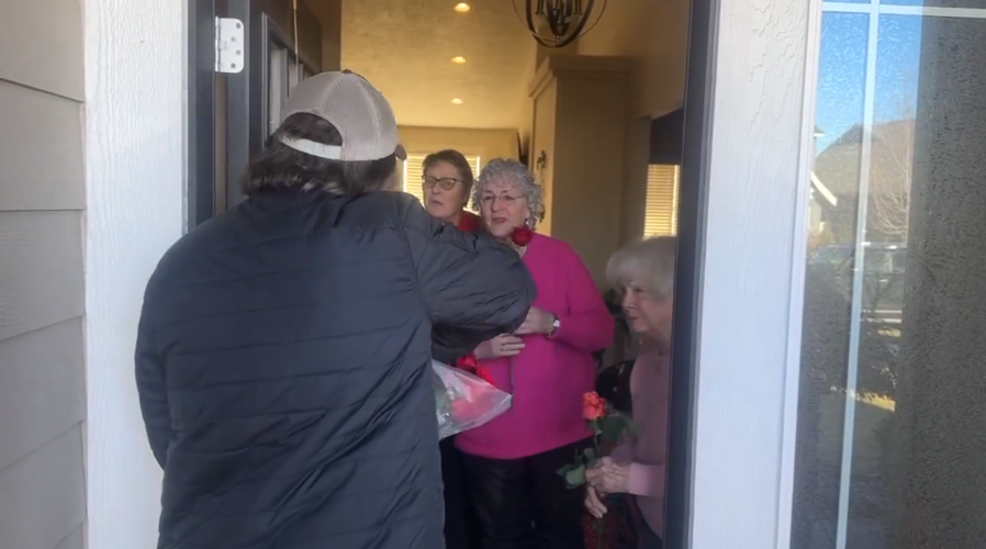 Handing Out Roses Local man and friends hand out roses to locals on Valentine's Day ...
