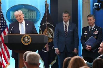 President Donald Trump speaks during a news conference at the White House on April 6, 2026, in Washington, as Defense Secretary Pete Hegseth and Chairman of the Joint Chiefs of Staff Gen. Dan Caine listen.
              AP Photo/Mark Schiefelbein, File