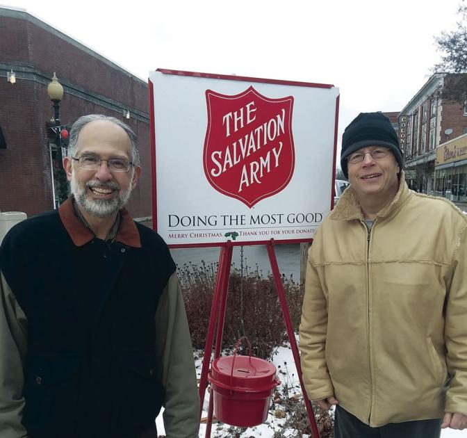 Members of the Laconia-Gilford Lions Club give a helping hand to the Salvation Army