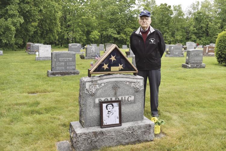 Joe Picard at the grave of his friend