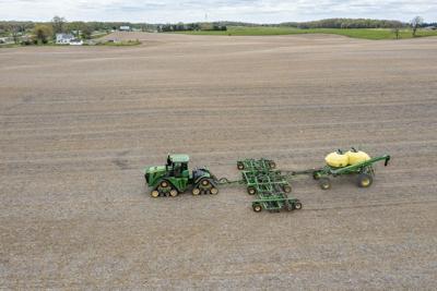 A farmer in Michigan spreads liquid fertilizer on a field.