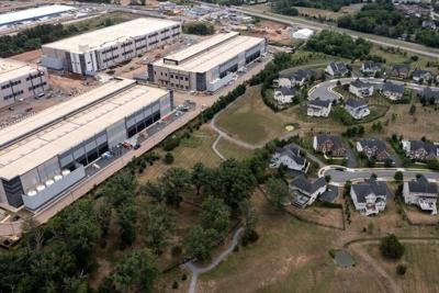 An Amazon data center sits next to a neighborhood in northern Virginia.