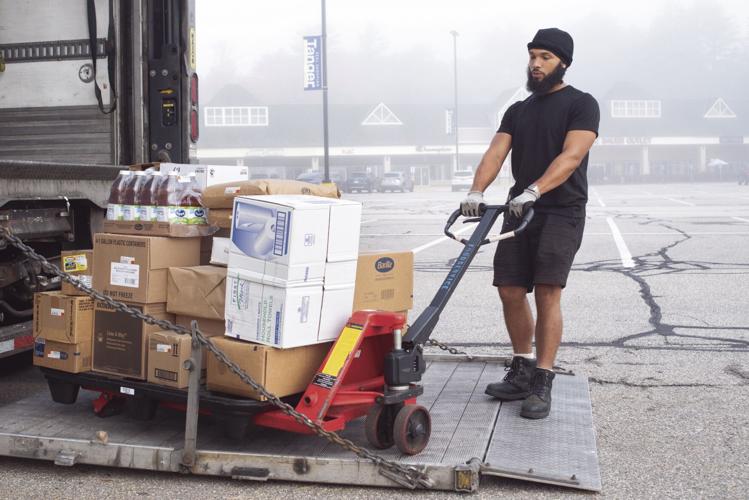 Francis Espinal unloading truck