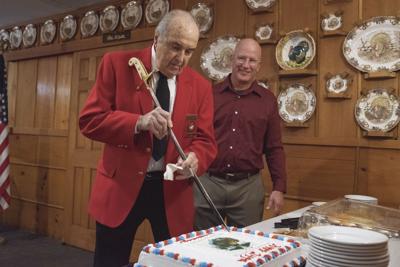 Bob Pelland cuts the cake