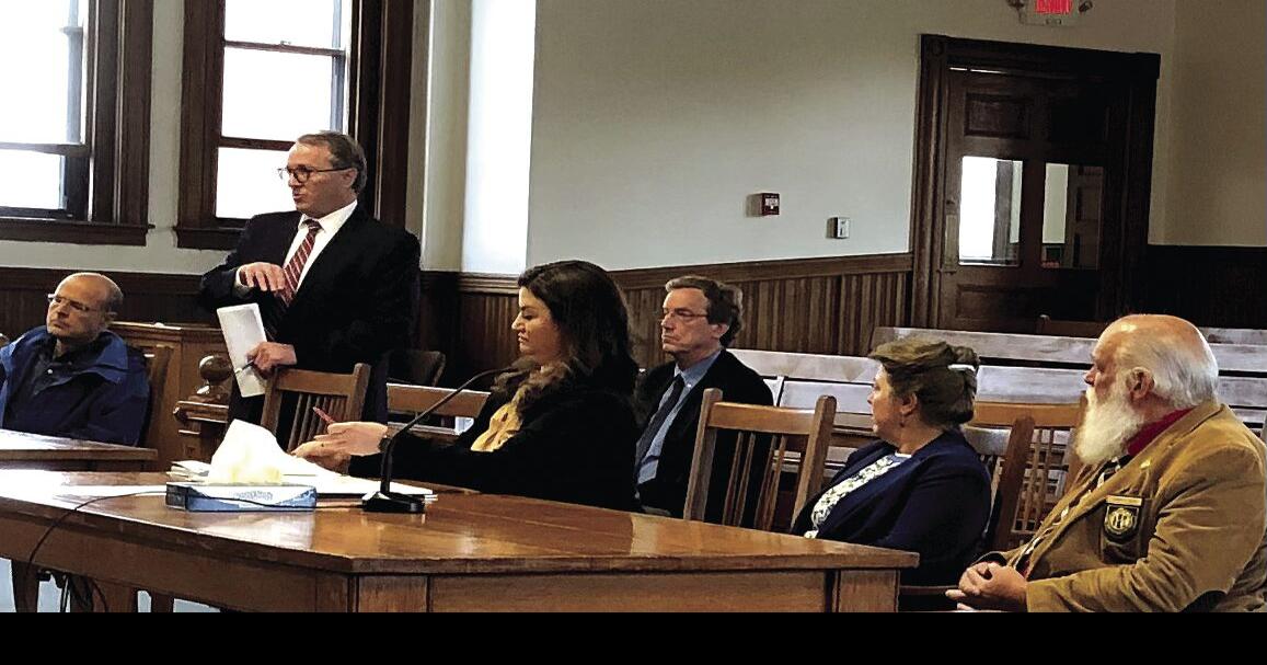 Judge weights Strang's request to join second suit against county reps Courts & Cops