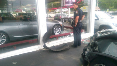 Through the glass - Car crashes German Motor Sports showroom