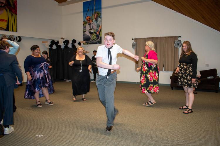 Students and staff dance