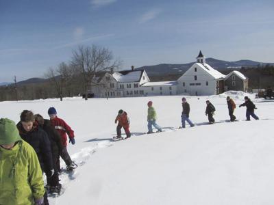 Children snowshoeing at Prescott Farm