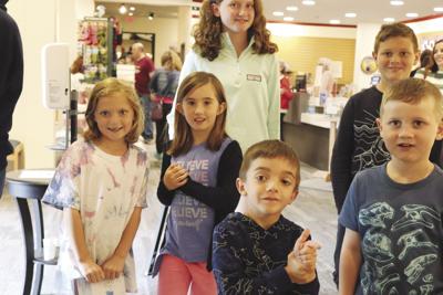 Young visitors having fun at the Wright Museum of WWII
