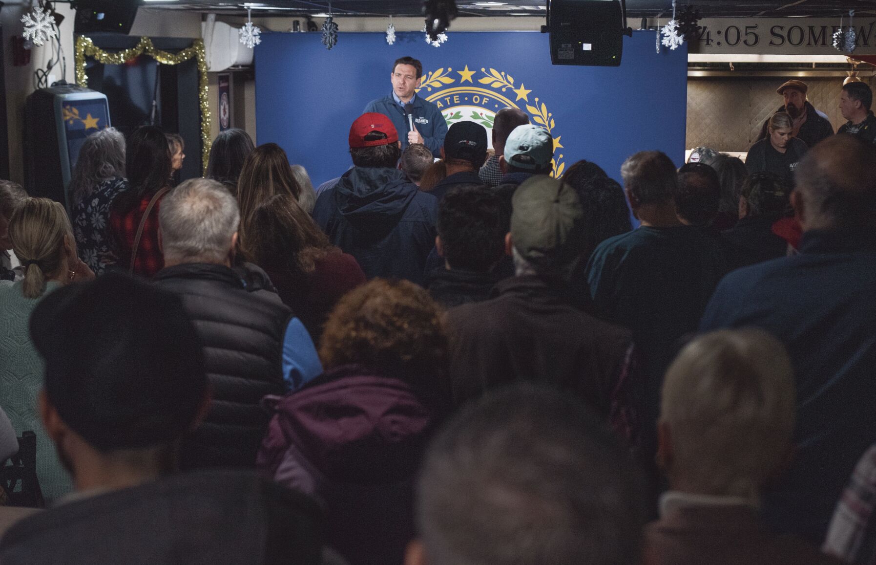 In front of the state flag