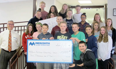 Bank donates funds for school's new playground equipment