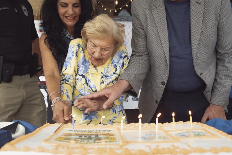 Cynthia and Hope cut the cake