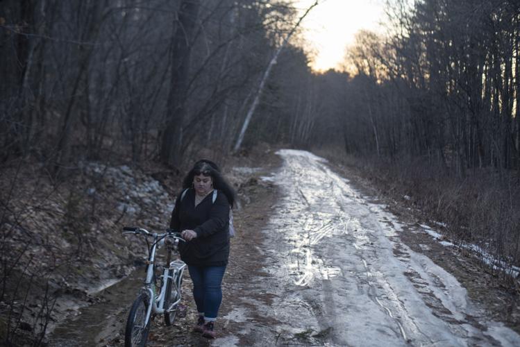 Jessika Gardner walks her bike