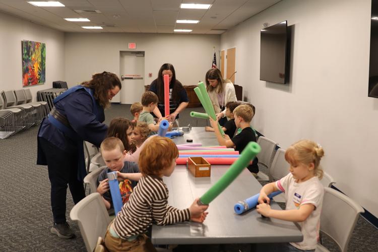 Kids constructing lightsabers