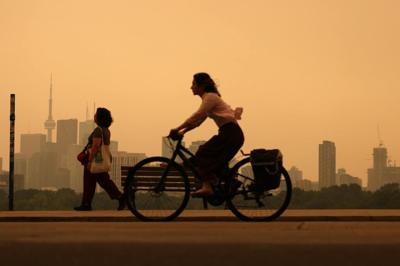 Heavy wildfire smoke from Canada's forests turn skies orange in Toronto and across parts of the U.S. in July 2026.