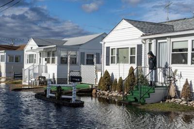 Water rises toward homes in Hampton, New Hampshire, on Jan. 10, 2024, after a storm with high winds, heavy rain and high seas.
              Joseph Prezioso/AFP via Getty Images
