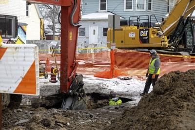 Workers repair a water pipeline that dates back to the 1930s. In the coming years, utility bills in Detroit are likely to rise to pay for upgrades to aging infrastructure.