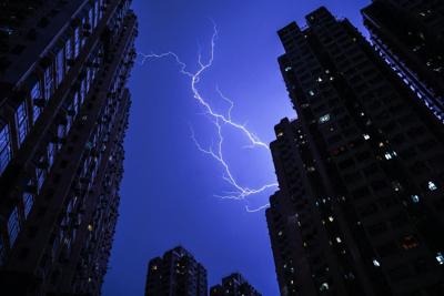 As lightning lights up apartment buildings, the thunder creates useful vibrations.