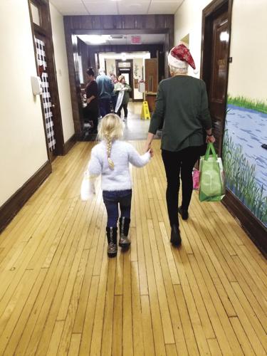 12-18 HOLIDAY holding hands with elf.jpg