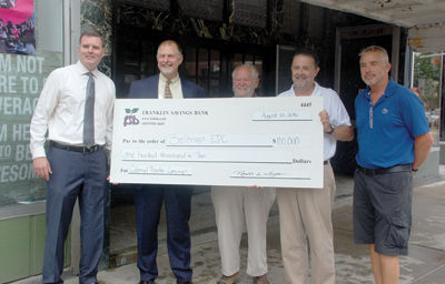 Colonial check - Franklin Savings contributes $100K for theater restoration