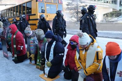 A large group of protesters, including clergy, gathered outside St. Paul International Airport in St. Paul, Minn., on Jan. 23, 2026, to demonstrate against the  immigration crackdown.