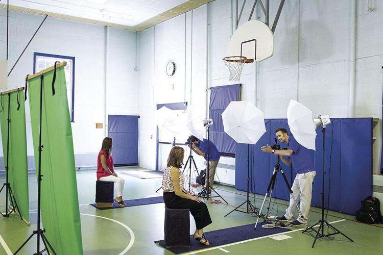 Geskus Employees taking school portraits.(Courtesy photo)