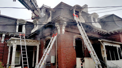 Woman hurt, 150-year-old building damaged in fire caused by smoking