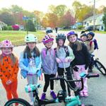 Laconia families take bike bus to school