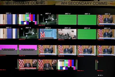 Screens in the James S. Brady Press Briefing Room show President Donald Trump delivering a primetime address on July 16, 2026, during which the White House unveiled a collection of declassified documents.