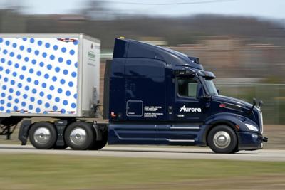 A self-driving tractor-trailer cruises around a test track in Pittsburgh.