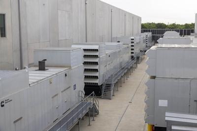 Diesel generators sit outside a data center in Ashburn, Va.