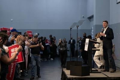 Supporters hold signs reading 'Make life affordable' at a James Talarico Senate campaign stop in Houston.