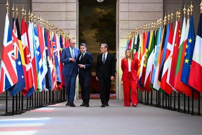 German Chancellor Friedrich Merz, French President Emmanuel Macron, British Prime Minister Keir Starmer and Italian Prime Minister Giorgia Meloni arrive for a press conference at the Elysee Palace in Paris on April 17, 2026.