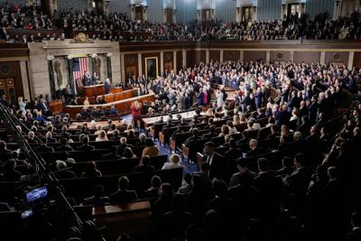 Republican members of Congress stand while Democrats keep their seats during President Donald Trump's State of the Union address at the U.S. Capitol on Feb. 24, 2026.