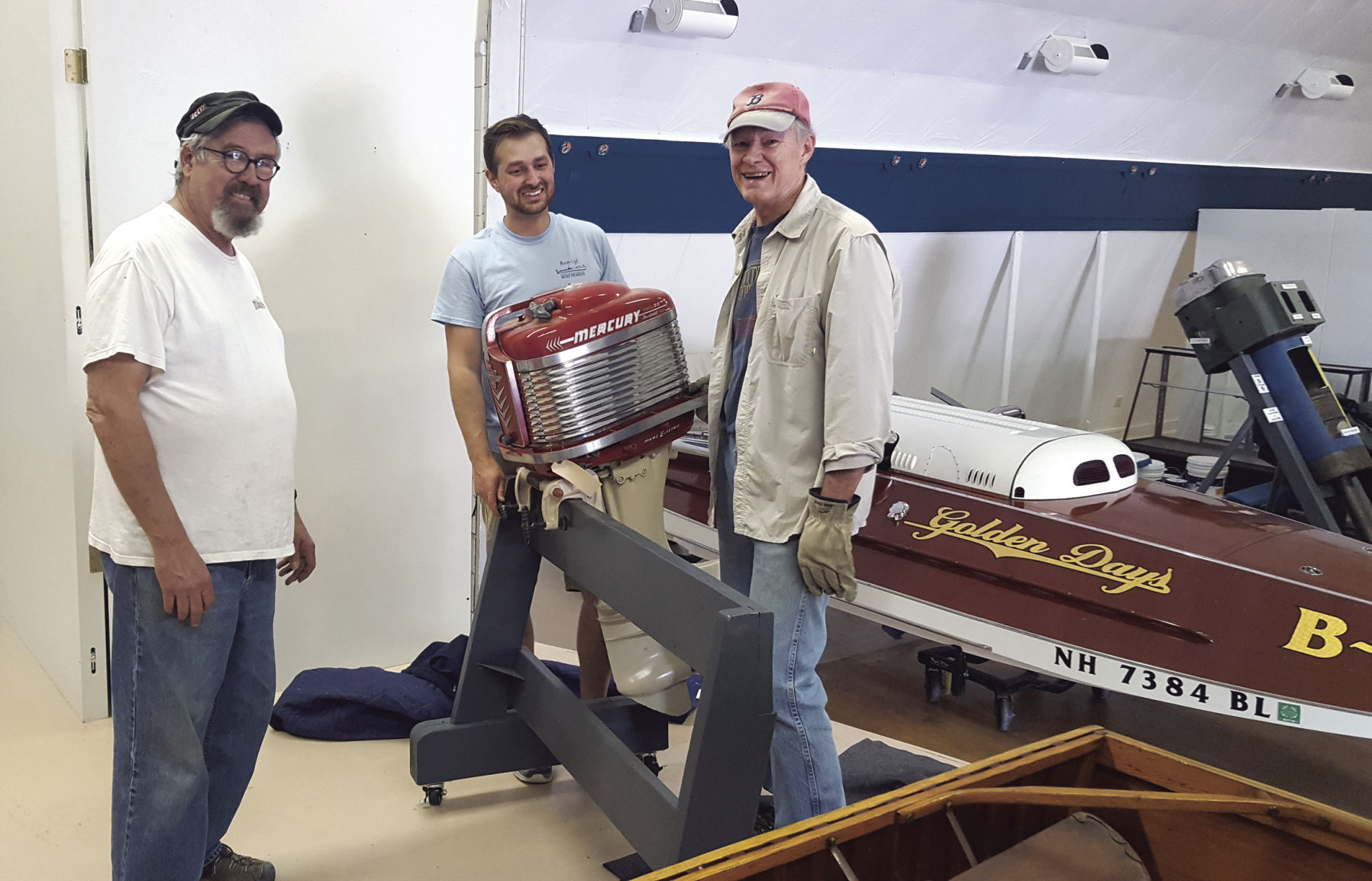 NH Boat museum volunteers moving motor