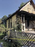 Home badly damaged in 2-alarm fire