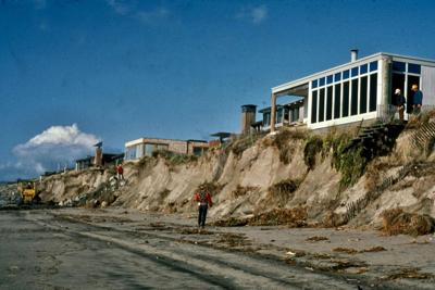 Storm waves eroded the dunes from beneath homes in Pajaro Dunes, Calif., on Monterey Bay, during the powerful 1982-83 El Nino. Gary Griggs