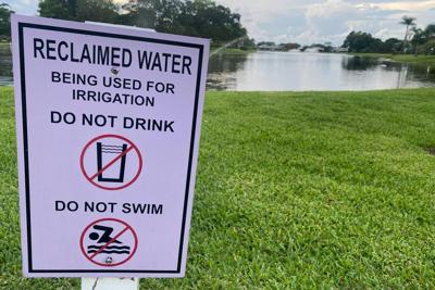 A sign warns passers-by that irrigation in the area uses treated sewage wastewater.