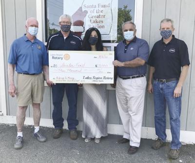 Rotary gives to Santa Fund