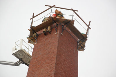 Chimney trim - 82-foot smokestack on Water Street is shortened