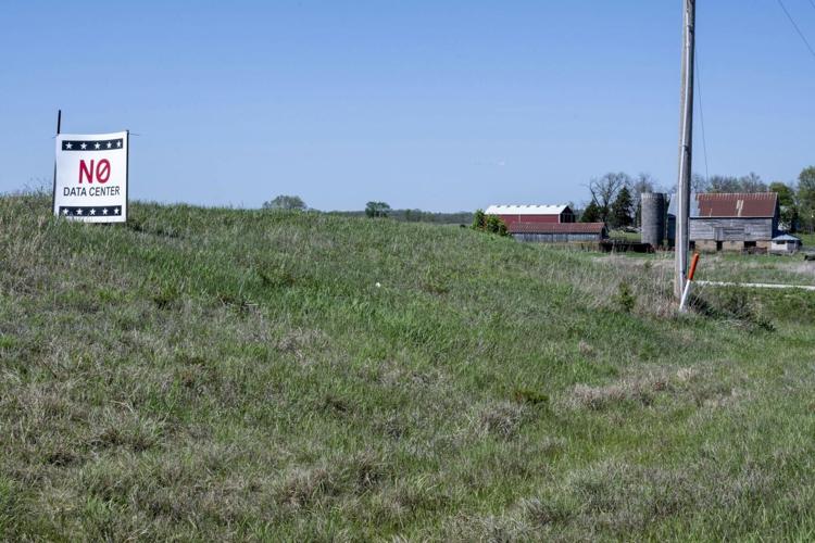A sign in a small town in Kansas opposes a proposal for a data center nearby.
