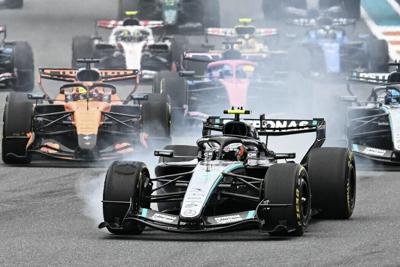 Formula 1 drivers maneuver for position during the 2026 Miami Formula One Grand Prix in Florida.