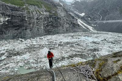 U.S. Geological Survey staff check monitoring equipment in Suicide Basin in June 2025. By August, the basin had filled with meltwater.