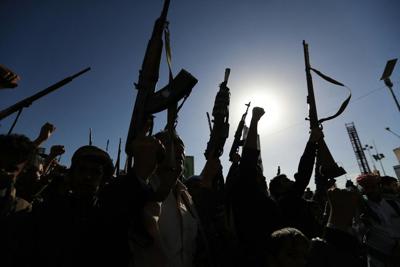 Supporters of Yemen's Houthis brandish their weapons during a protest against Saudi intervention in Yemen on Oct. 8, 2026.