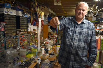 Owner sells tackle shop, but still can't spit the hook