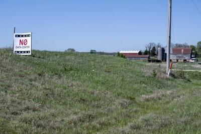 A sign in a small town in Kansas opposes a proposal for a data center nearby.
