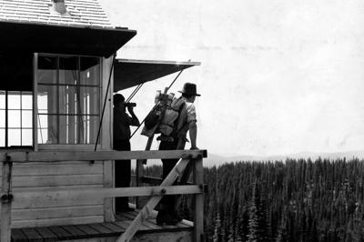 Before satellites, fire crews watched for smoke from fire towers across the national forests. K. D. Swan, U.S. Forest Service